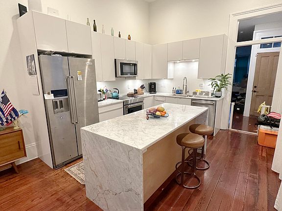 Kitchen with full KitchenAid appliance suite and induction range