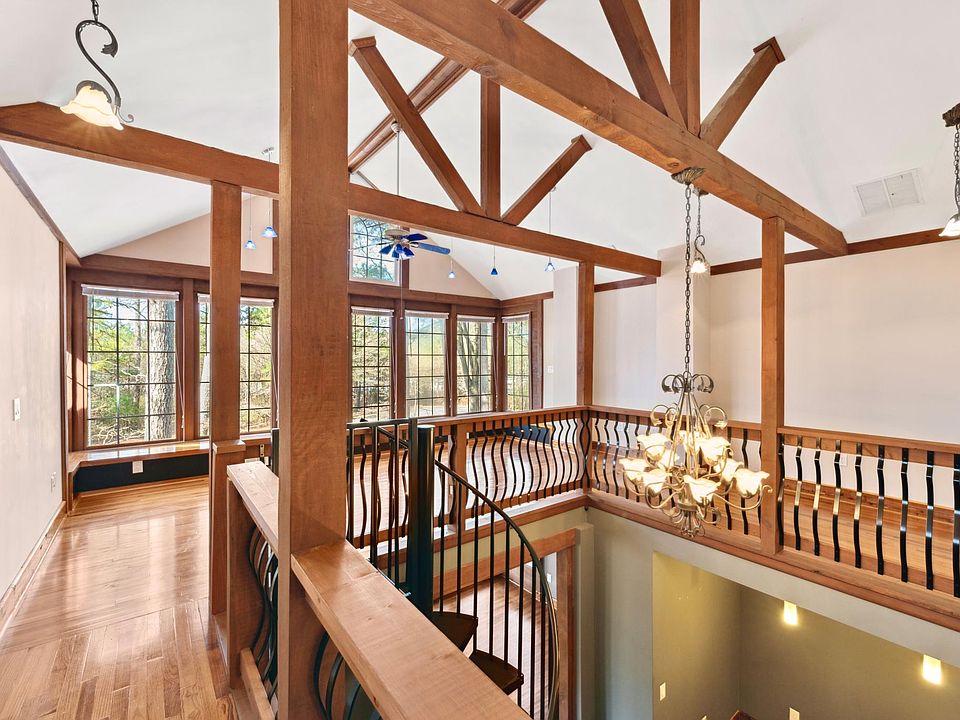 Stunning upstairs flex space has tons of light, beautiful wood beams and floors, elegant light fixtures, and good vibes.