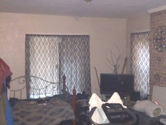Large Living room area - There is an exercise bike, daybed,