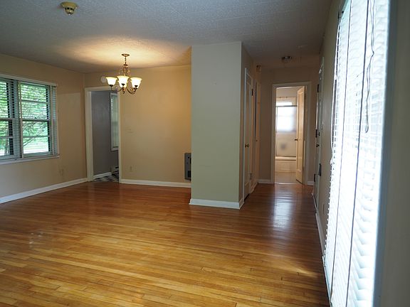 Living room looking towards kitchen (on the left) and bathroom (straight ahead),