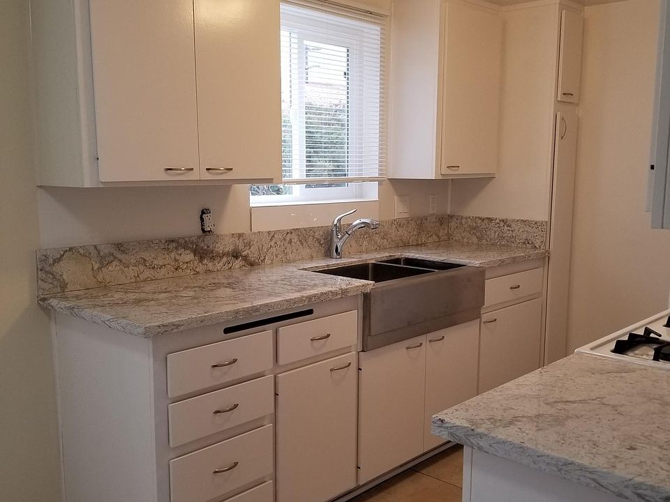 Fully remodeled kitchen. Granite counter tops. Stainless steel sink. Tiled flooring.