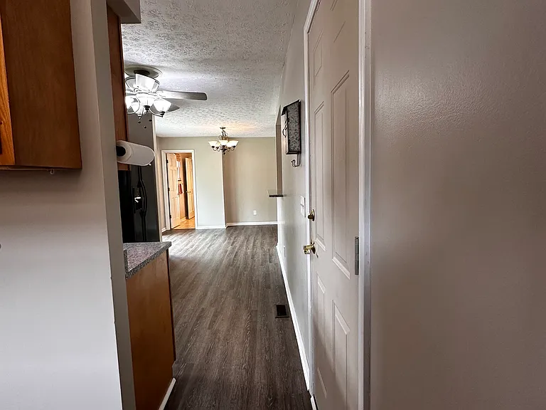 Door to and from the garage opens between utility area and kitchen.