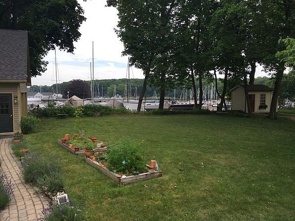 MILFORD BOAT WORKS : VIEW OF THE BOATYARD AND HARBOR FROM BACK DECK