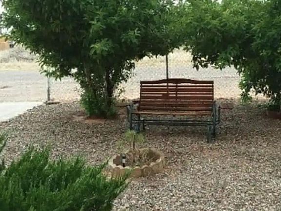 Front yard and smoking area, apple trees.