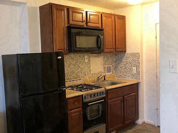 Kitchen - gas stove, microwave, refrigerator, sink, disposal