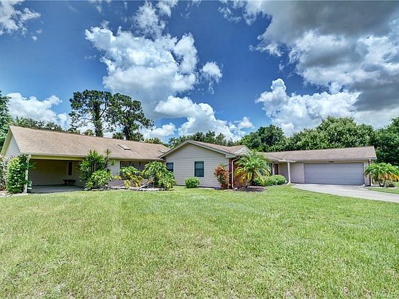 The 1,000 sq ft apartment is to the left with a carport and it's own entrance.