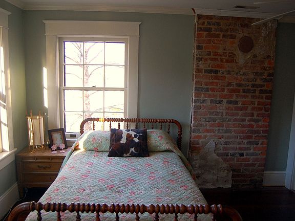 the corner bedroom with brick chimney