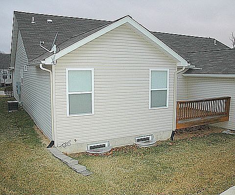 Back of home with deck off Living room