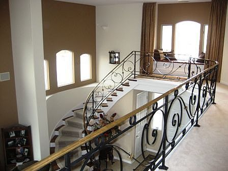 Wrought-Iron Custom Staircase w/Brass Rails