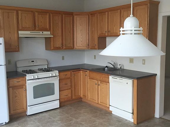 Spacious, sunny modern kitchen with eating area and sliding