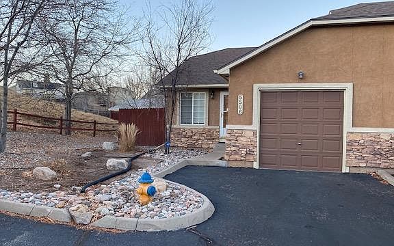 Private VERTICAL parking space right in front of garage. Photo is deceiving as you don't have to park sideways.