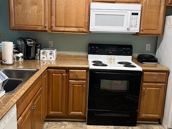 Newer kitchen and flooring. Fully stocked kitchen. Washer and Dryer in Unit