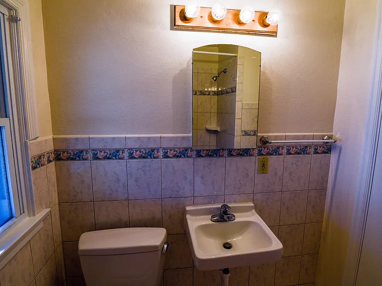 Bathroom Toto toilet, sink, medicine cabinet