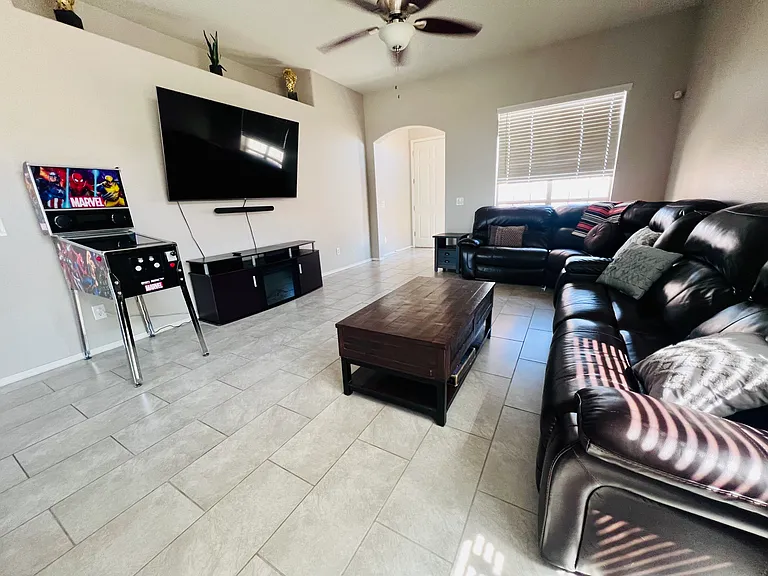 Extra large living space with lots of natural light. Photo shows front door entrance.