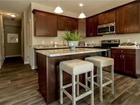 Photos of previously sold unit by same builder. Subject property to have similar finishes.