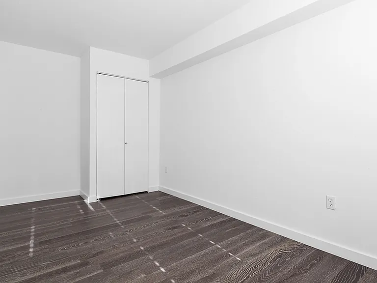 Large bedroom with dual-door closet