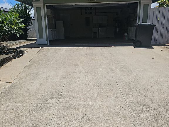 2 car garage with washer, dryer, utility sink, extra fridge, and lots of storage