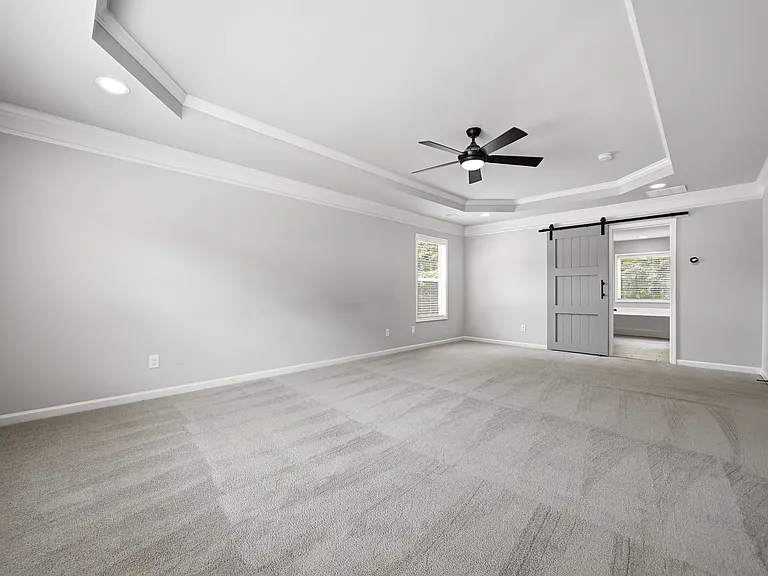 Master suite with tons of natural light & tray ceiling