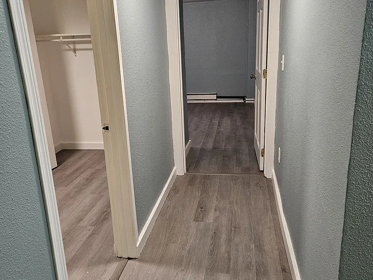 Into second hallway, towards bedroom 2 and 3.