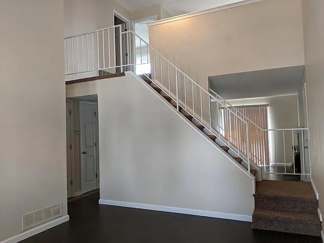Living Room and view of Upstairs. Easy care tile floors new 3 years ago.