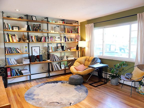 living room. Shelving units stay with rental