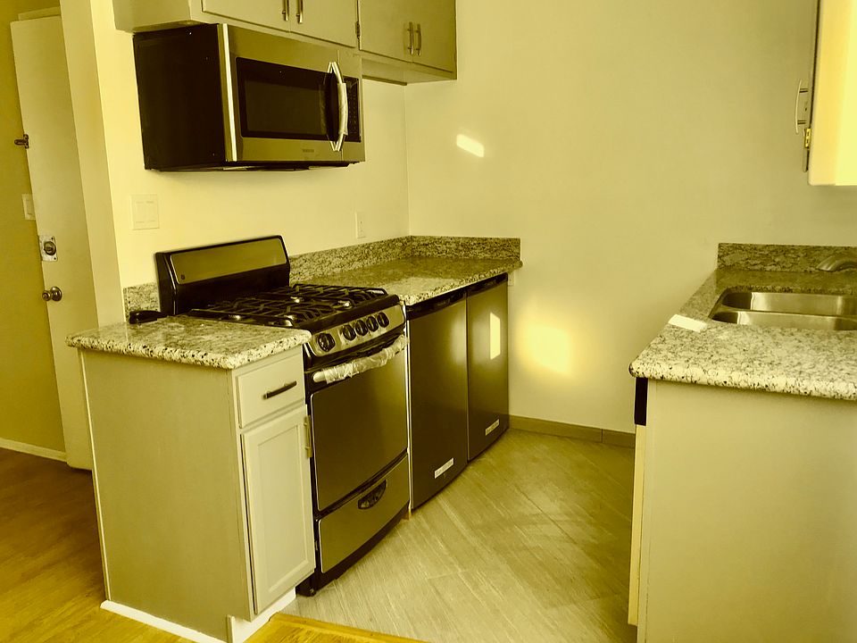 Tiled floor in upstairs kitchen, walk-in closet & bath. Extra Fridge. All appliances included.