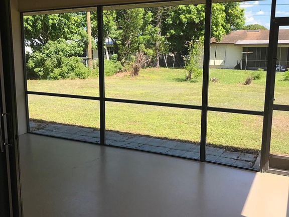 Screened lanai with spacious backyard
