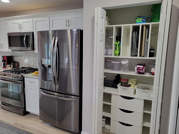 New kitchen pantry; upgraded (2022) cabinet systems in all of the closets, laundry room and kitchen