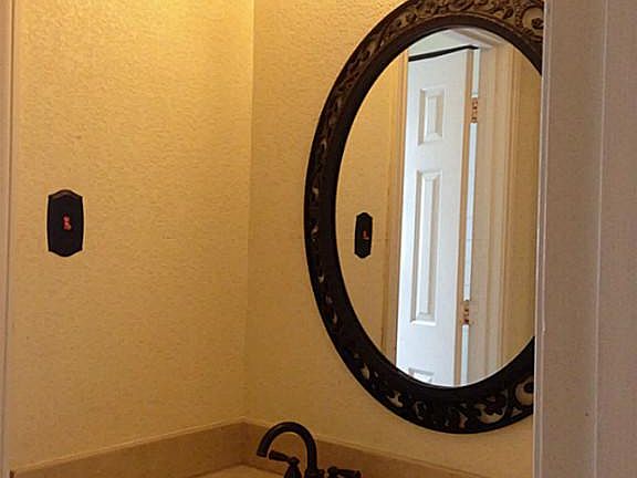 Matching vanities across from one another in the upstairs bath