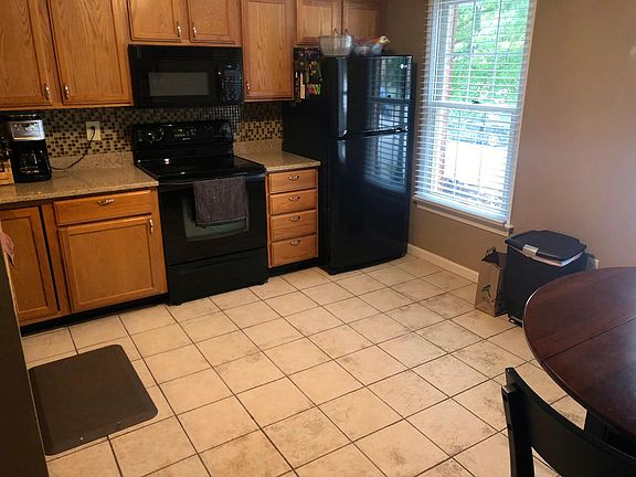 Large kitchen with room for eat in kitchen table.