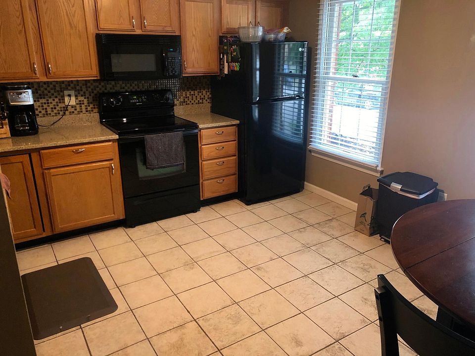 Large kitchen with room for eat in kitchen table.