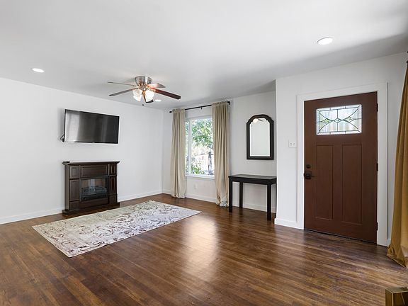 electric fireplace, original wood floors