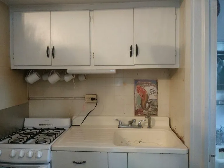 Efficiency size kitchen with the bathroom to the right