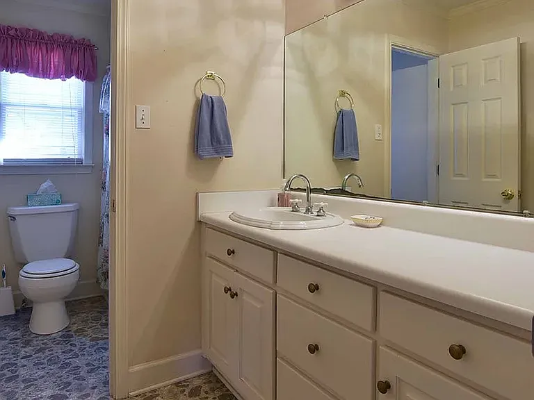main bathroom in hallway directly across from bedroom 2 door.