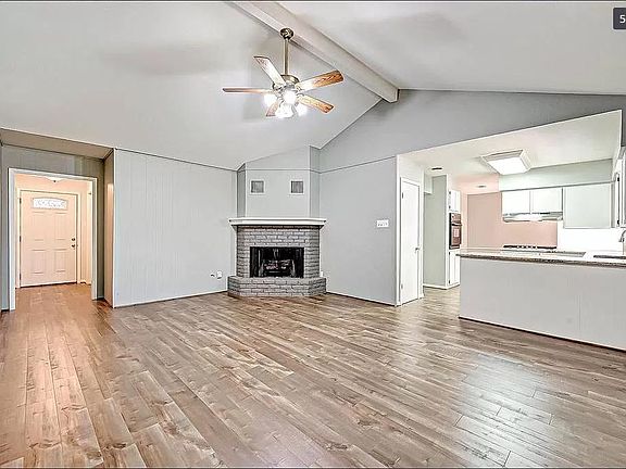 Fireplace display and custom wood trim mantle.