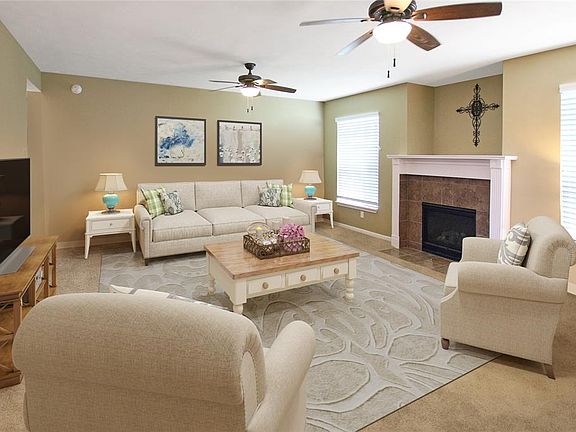This large living area is open to kitchen area, making a great space for entertaining or relaxing.*photo has been virtually staged