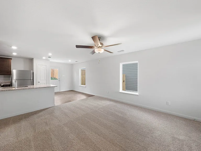 The open layout connects the family room with the kitchen and dining room.