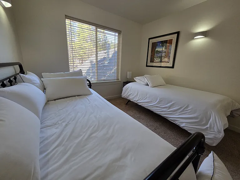 Bedroom 1 with daybed arranged in 2 twin beds.
