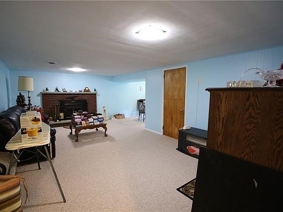 AWERSOME 23x13 Finished Game Room w/ Newer Berber Carpeting & Log Burning Brick Fireplace