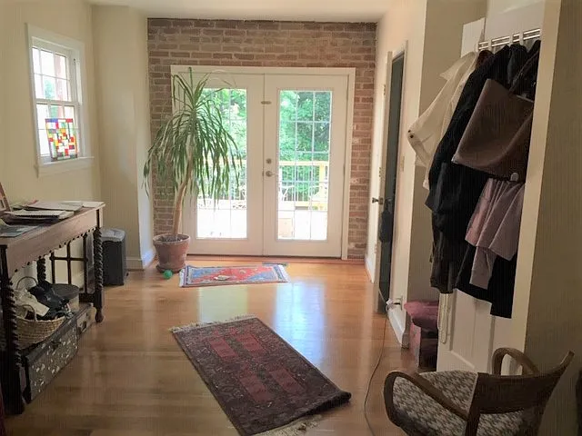 View to french doors in living room leading onto outside deck