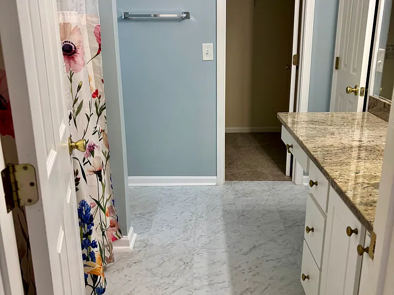 Primary bath, includes 2 separate closets! Beautiful granite countertop