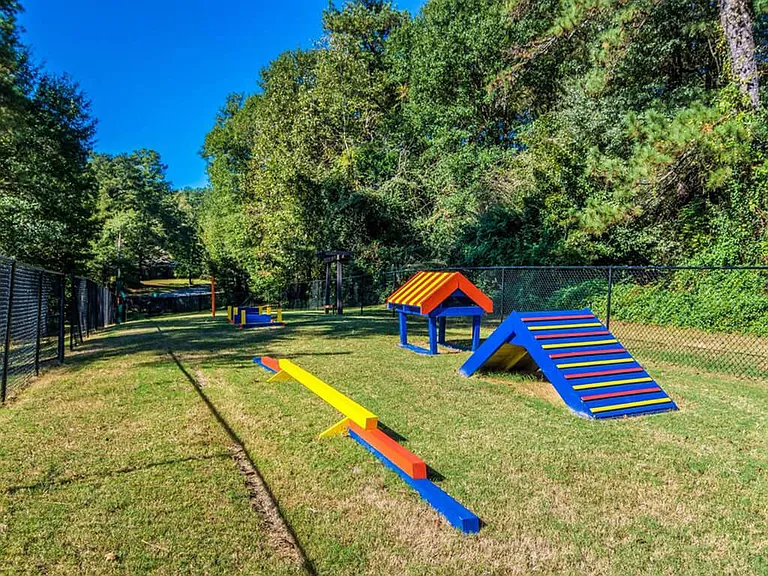 Private Paw Park with Watering Station & Agility Equipment.