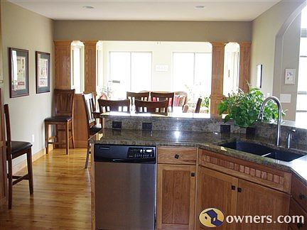 View of kitchen, dining area, and 4-seasons roomm