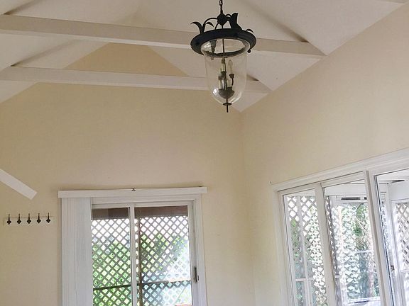 Large family room. Please note that the sliding door at end of the room has been removed which provides wonderful wall space and placement of furniture. The sliding door to the right , leads to the screen porch and new deck/backyard. This photo will be up