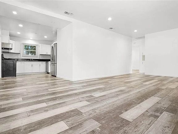 Bright and open interior spaces. Living room with recessed lights, luxury vinyl plank flooring and more