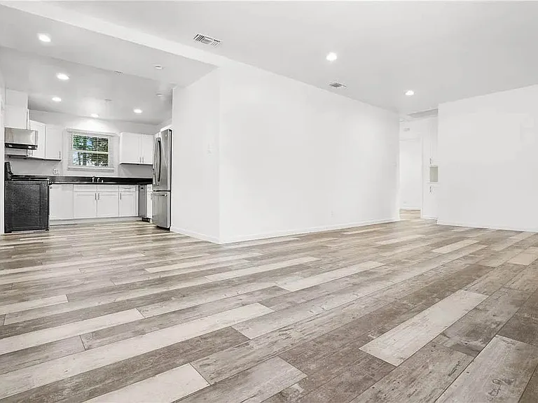 Bright and open interior spaces. Living room with recessed lights, luxury vinyl plank flooring and more
