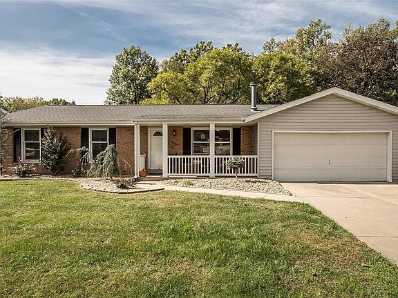 Beautiful Brick Facade, new Roof, no maintenance Siding and a covered porch and a long driveway for extra parking!