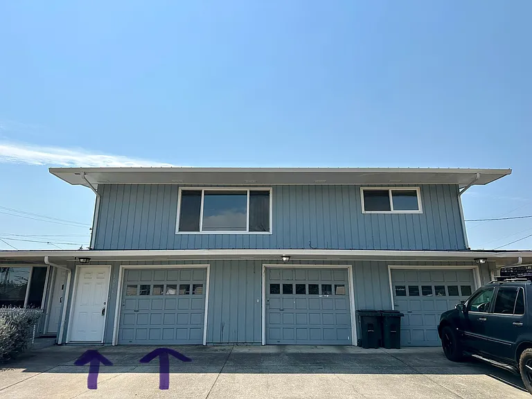 Door to entrance and garage door for unit. Garage can be entered from inside unit.