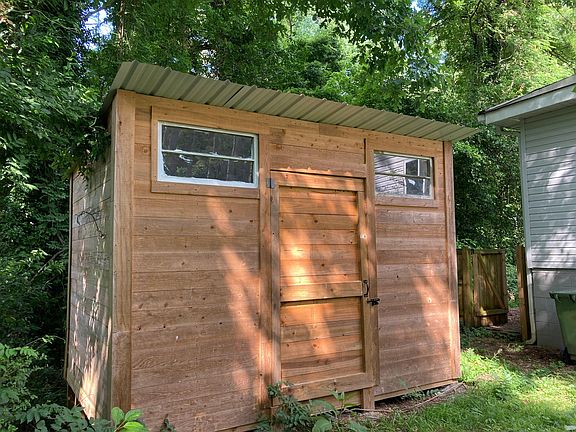 Good-sized cedar storage shed for bicycles, tools, and other equipment
