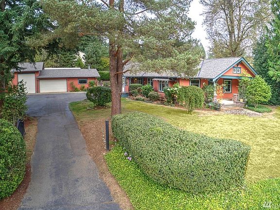 Mature trees and a well manicured front yard set the scene for this gem of a home 